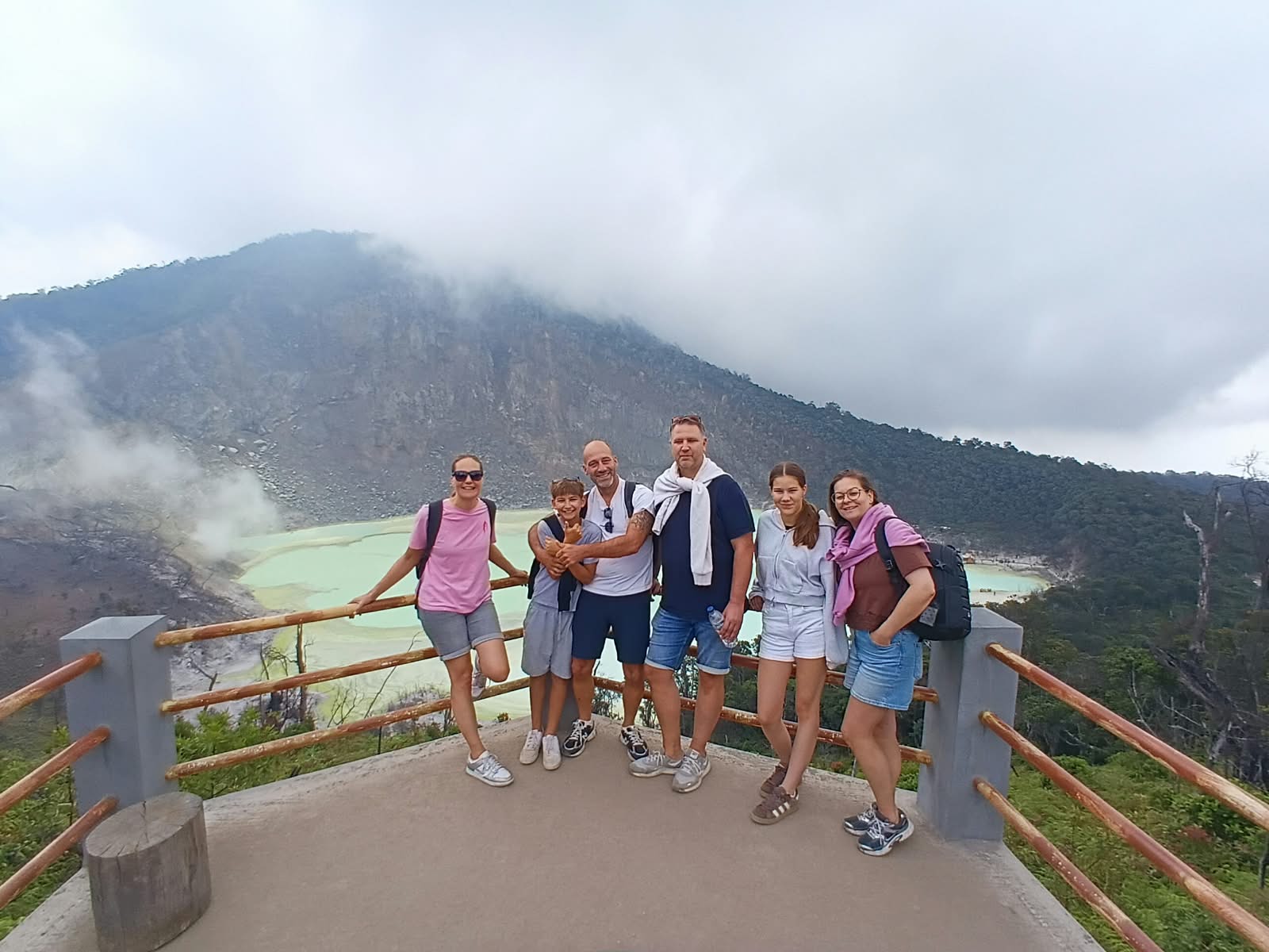Travelers at the turquoise White Crater lake